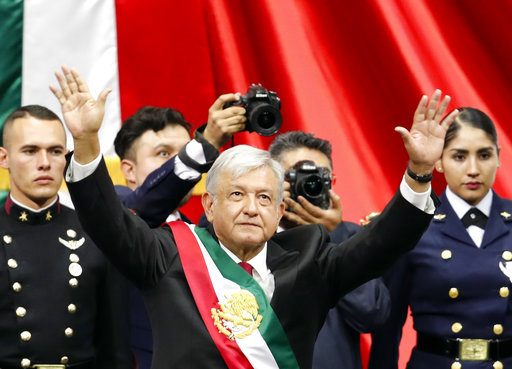 Mexico's new President Andres Manuel Lopez Obrador greets the crowd at the end of his inaugural ceremony at the National Congress in Mexico City, Saturday, Dec. 1, 2018. [Photo: AP]