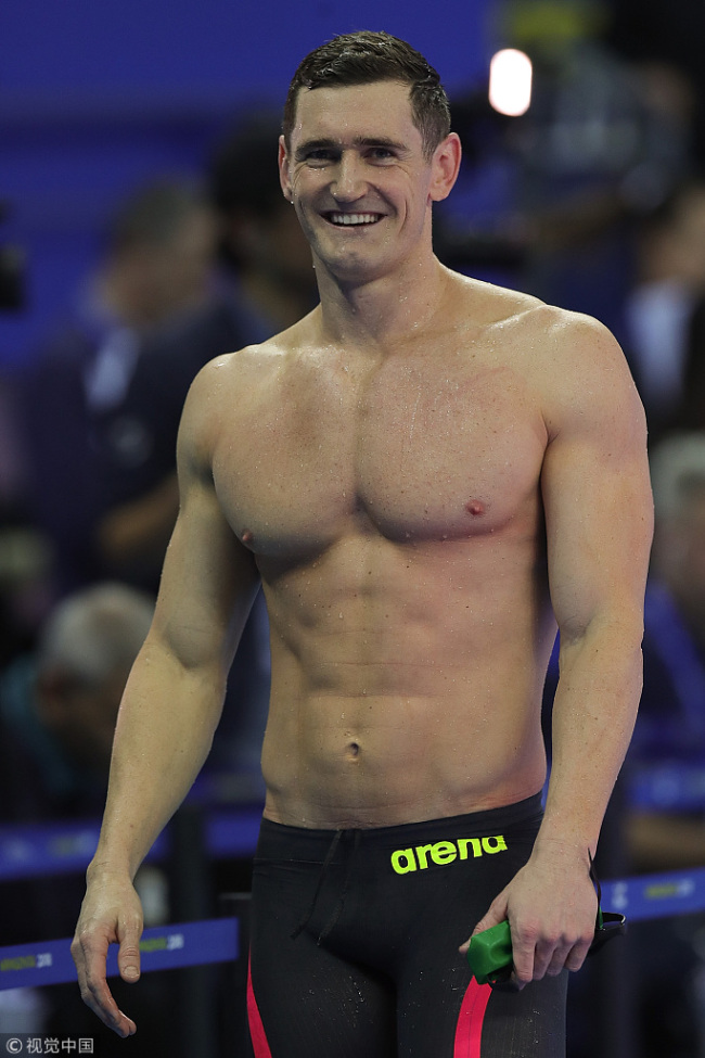 South Africa's Cameron van der Burgh celebrates after winning the men's 100-meter breaststroke final at the 14th FINA World Swimming Championships at the Hangzhou Olympic Sports Expo on Wednesday, December 12, 2018. [Photo:VCG]