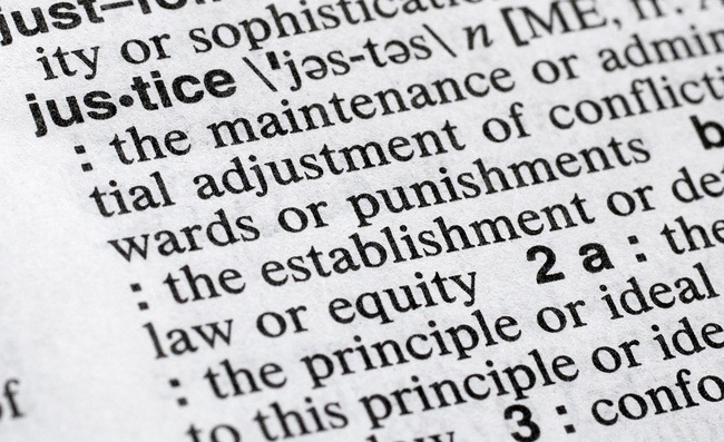 In this Dec. 12, 2018, photo, "justice" is displayed in a Merriam-Webster dictionary in New York. Merriam-Webster has chosen "justice" as its 2018 word of the year, driven by the churning news cycle and President Trump's Twitter feed. [Photo: AP/Mark Lennihan]