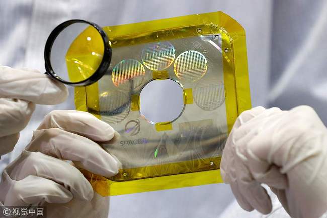 A Israeli organization SpaceIL holds during its presentation to the medias the "Time capsule" intended to travel to the moon with the spacecraft on early 2019, in Yehud, Eastern Tel Aviv, on December 17, 2018. The time capsule is a device containing informations about the state of Israel such as cultural heritage, songs, pictures, flags... etc. [Photo:VCG/JACK GUEZ]