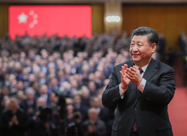 Chinese President Xi Jinping, also general secretary of the Communist Party of China (CPC) Central Committee and chairman of the Central Military Commission, applauds for the personnel awarded with medals during a grand gathering to celebrate the 40th anniversary of China's reform and opening-up at the Great Hall of the People in Beijing, capital of China, Dec. 18, 2018. Xi made an important speech at the gathering. [Photo: Xinhua/Xie Huanchi]