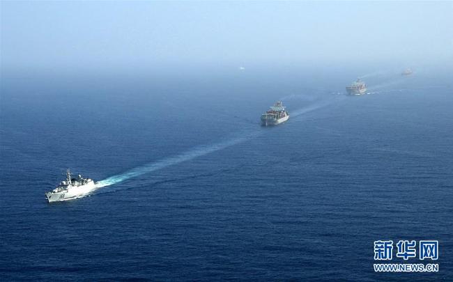 Chinese merchant ships sail from Sanya to Gulf of Aden under the protection of a convoy led by the PLA Navy missile destroyer Wuhan on January 6, 2009. [File photo: Xinhua]