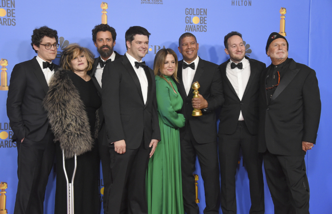 The cast and crew of "Spider-Man: Into the Spider-Verse" pose in the press room with the award for best motion picture, animated at the 76th annual Golden Globe Awards at the Beverly Hilton Hotel on Sunday, Jan. 6, 2019, in Beverly Hills, Calif. [Photo: Invision/AP/Jordan Strauss]