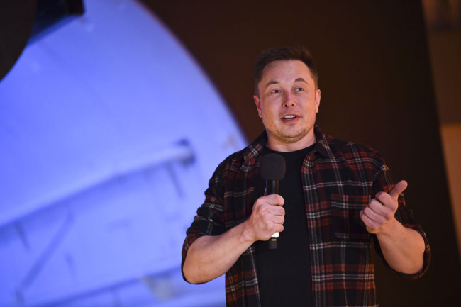 Elon Musk, co-founder and chief executive officer of Tesla Inc., speaks during an unveiling event for the Boring Co. Hawthorne test tunnel in Hawthorne, Calif., on Tuesday, Dec. 18, 2018. [Photo: Pool via AP/Robyn Beck]