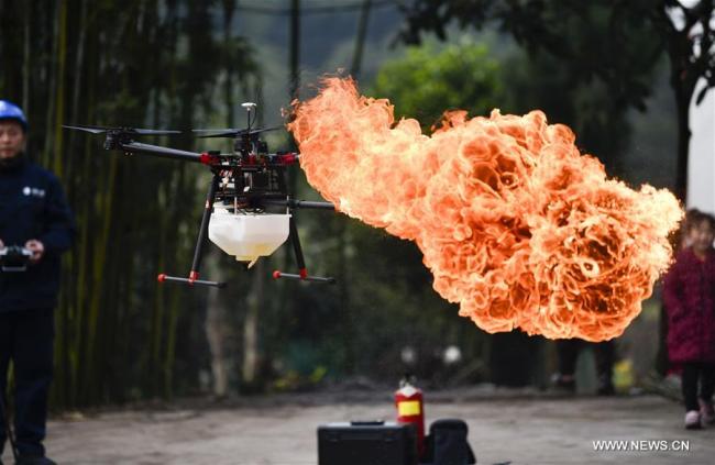 A flame-spurting drone is seen during a demonstration in Chongqing, southwest China, Jan. 16, 2019. [Photo: Xinhua]