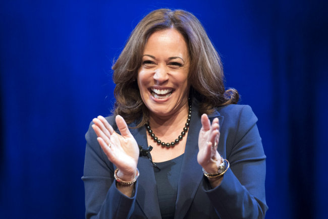 In this Jan. 9, 2019 photo, Sen. Kamala Harris, D-Calif., greets the audience at George Washington University in Washington, during an event kicking off her book tour. Harris, a first-term senator and former California attorney general known for her rigorous questioning of President Donald Trump’s nominees, entered the Democratic presidential race on Monday. [Photo: AP]