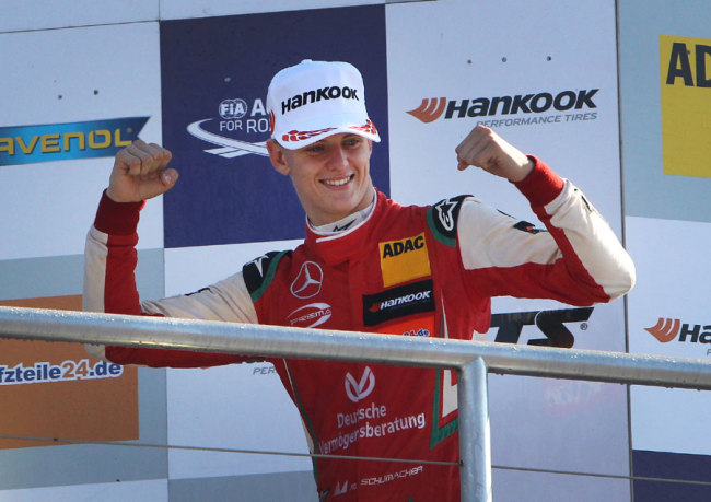 Mick Schumacher celebrates after winning the FIA Formula Three European Championship at the Hockenheim race track in Hockenheim, western Germany, on October 14, 2018. [File Photo: Daniel ROLAND/AFP]