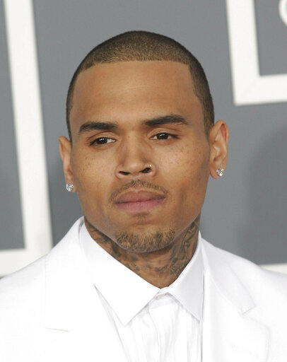 File photo of Chris Brown attending the 55th Annual Grammy Awards in Los Angeles, California on Feb 10, 2013. [Photo: AP/STAR MAX]