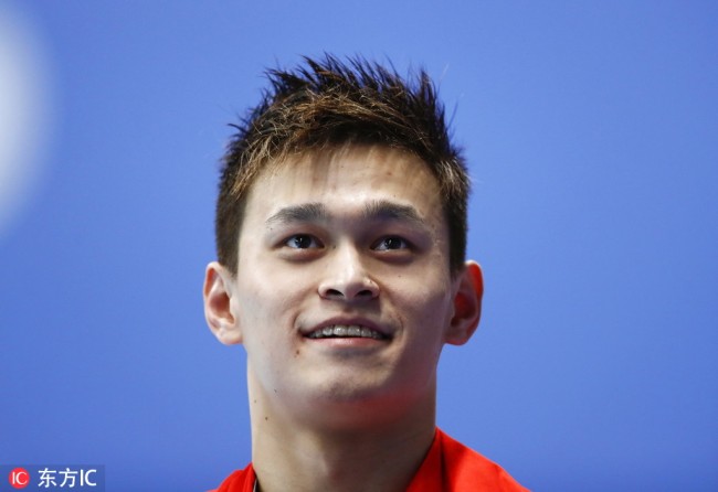 Sun Yang smiles on the podium after winning the gold medal in the Men's 400m Freestyle Swimming final at the 2018 Asian Games in Jakarta, Indonesia, 21 August 2018. [Photo: IC]