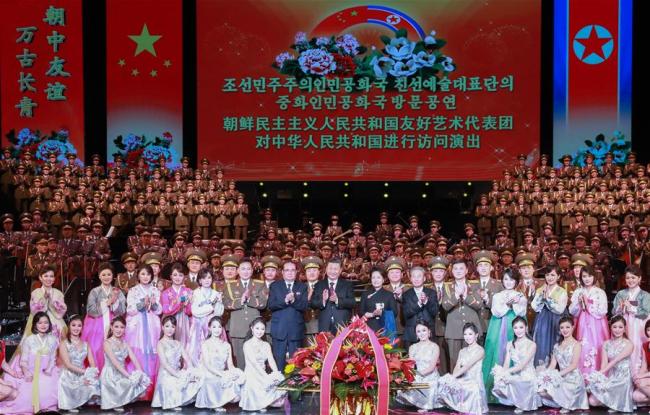 Xi Jinping, general secretary of the Communist Party of China (CPC) Central Committee and Chinese president, and his wife Peng Liyuan pose for a group photo with artists of an art troupe from the Democratic People's Republic of Korea (DPRK) after watching their performance in Beijing, capital of China, Jan. 27, 2019. Xi and Peng met with the art troupe led by Ri Su Yong, a member of the Political Bureau of the Workers' Party of Korea (WPK) Central Committee, vice-chairman of the WPK Central Committee and director of the party's International Department, before its performance.[Photo:Xinhua]