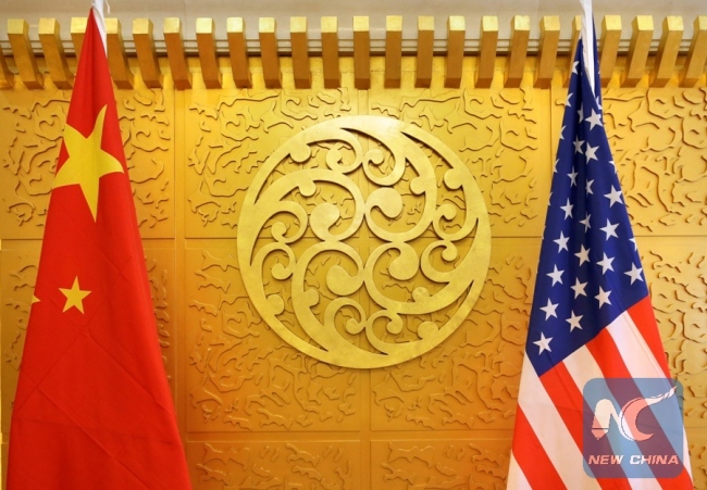 Chinese and U.S. flags are set up for a meeting during a visit by U.S. Secretary of Transportation Elaine Chao at China's Ministry of Transport in Beijing, China April 27, 2018.[File Photo:Xinhua/REUTERS]