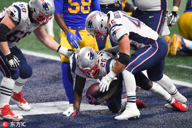 New England Patriots running back Sony Michel (26) scores a touchdown during the fourth quarter in Super Bowl LIII against the Los Angeles Rams at Mercedes-Benz Stadium. [Photo: USA TODAY Sports/Dale Zanine]