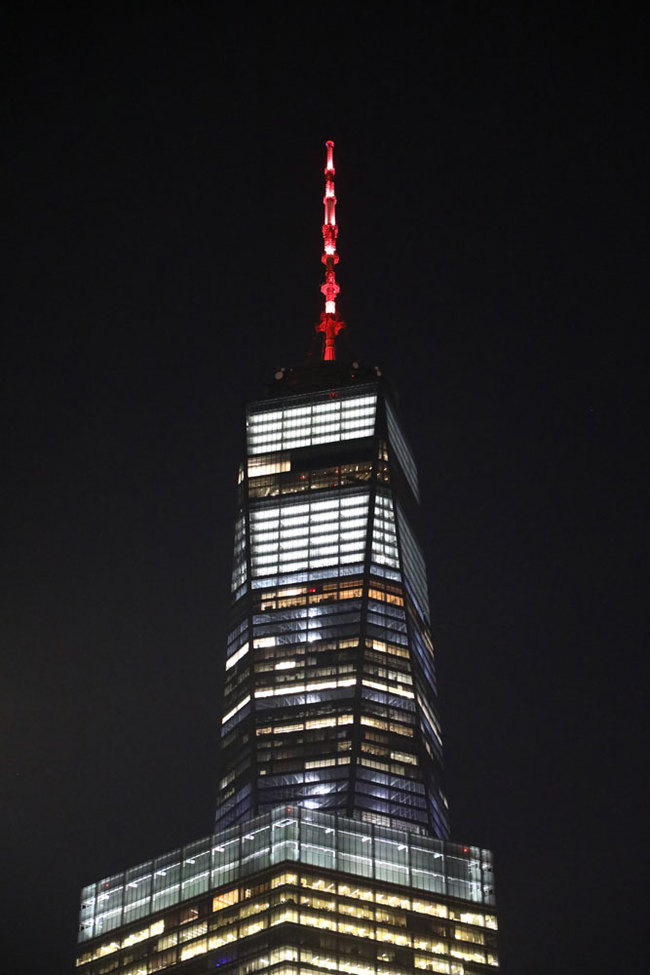 The One World Trade Center in New York City is seen lit up on Sunday February 3, 2019 to celebrate the upcoming Chinese New Year. This is the first time that the tallest building in the United States is glowing for the celebration of the Chinese New Year. The Lunar New Year, which will be the year of the pig, starts on February 5. [Photo: China Plus/Qian Shanming]