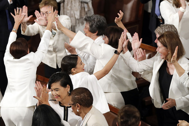  Members of Congress cheer after President Donald Trump acknowledges more women in Congress during his State of the Union address to a joint session of Congress on Capitol Hill in Washington, Tuesday, Feb. 5, 2019. [Photo: AP]
