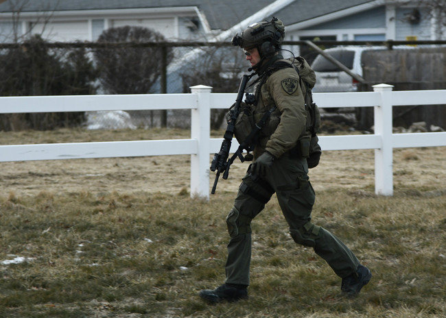 A law enforcement officer works at the scene of a shooting at the Henry Pratt Co. on Friday, Feb. 15, 2019, in Aurora, Ill. Officials say several people were killed and at least five police officers were wounded after a gunman opened fire in an industrial park. [Photo: AP/Matt Marton]