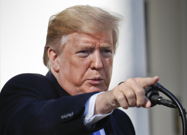 President Donald Trump points to a member of the media while taking questions after speaking during an event in the Rose Garden at the White House to declare a national emergency in order to build a wall along the southern border, Friday, Feb. 15, 2019 in Washington. [Photo: AP/Pablo Martinez Monsivais]