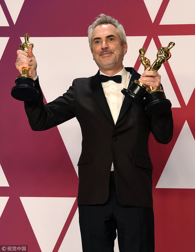 Alfonso Cuaron, winner of Best Foreign Language Film, Best Director and Best Cinematography for 'Roma,' poses in the press room during the 91st Annual Academy Awards at Hollywood and Highland on February 24, 2019 in Hollywood, California.[Photo: Frazer Harrison/Getty Images] 