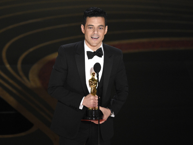 Rami Malek accepts the award for best performance by an actor in a leading role for "Bohemian Rhapsody" at the Oscars on Sunday, Feb. 24, 2019, at the Dolby Theatre in Los Angeles. [Photo: AP/ Chris Pizzello]
