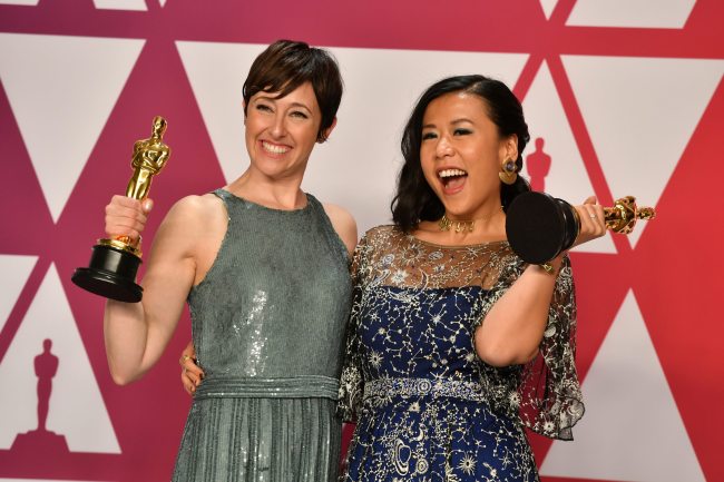 Becky Neiman-Cobb, left, and Domee Shi pose with the award for best animated short for "Bao" in the press room at the Oscars on Sunday, Feb. 24, 2019, at the Dolby Theatre in Los Angeles. [Photo: AP/Jordan Strauss /Invision]