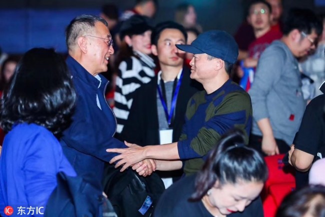 Jack Ma from e-commerce giant Alibaba Group greets Liu Chuanzhi, the chairman of Legend Holdings Corporation, during a promotional event for new movie "Green Book" in Beijing on Monday, February 25, 2019. [Photo: IC]
