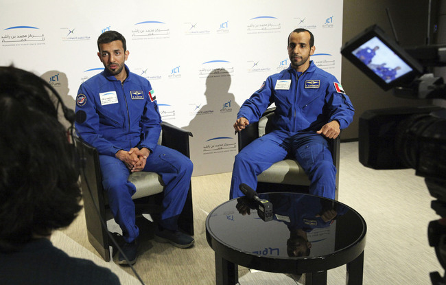 Emirati astronauts Sultan al-Neyadi, left, and Hazza al-Mansoori, are interviewed by The Associated Press in Dubai, United Arab Emirates, Monday, Feb. 25, 2019. The UAE said on Monday it will send either astronaut al-Mansoori or al-Neyadi to the International Space Station on Sept. 25 aboard a Russian Soyuz rocket. The UAE has a fledgling space program with big ambitions. [Photo: AP /Jon Gambrell]