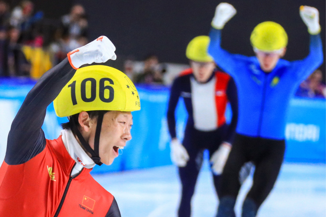 China's An Kai celebrates after winning the gold medal in men's 1500m short track speed skating event at the 29th Winter Universiade in Krasnoyarsk, Russia on Mar 4, 2019. [Photo: IC]