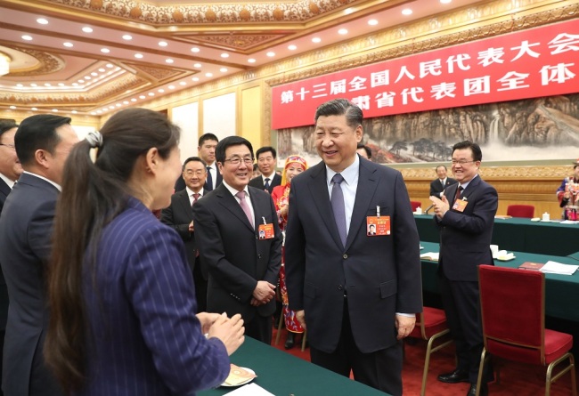 Chinese President Xi Jinping attends a panel discussion with his fellow deputies from Gansu Province at the second session of the 13th National People's Congress in Beijing, March 7, 2019. [Photo: Xinhua]