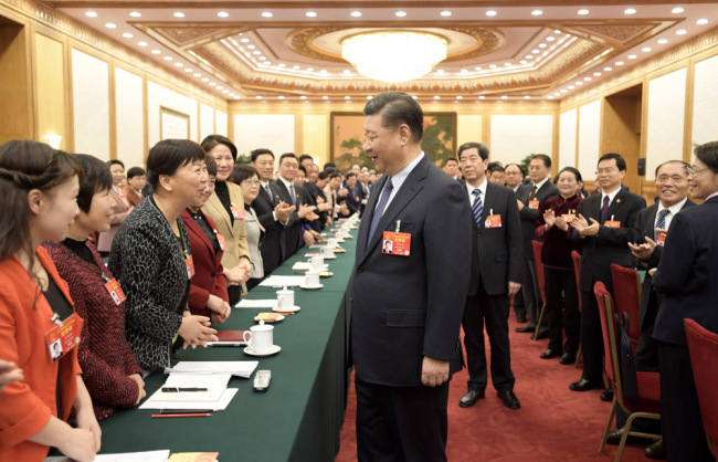 President Xi Jinping attends a panel discussion with his fellow deputies from Henan Province at the second session of the 13th National People's Congress in Beijing, March 8, 2019. [Photo: Xinhua]