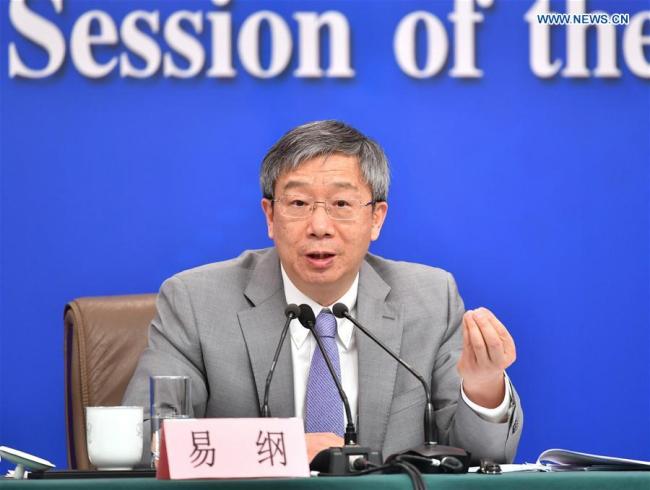 Governor of the People's Bank of China Yi Gang attends a press conference on the financial reform and development for the second session of the 13th National People's Congress (NPC) in Beijing, capital of China, March 10, 2019. [Photo: Xinhua/Li Ran]