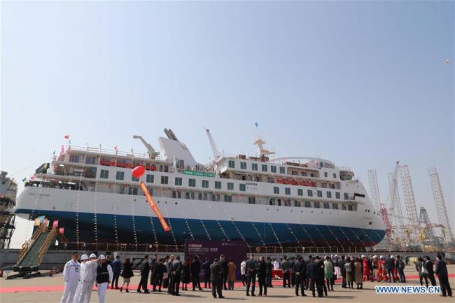 Photo taken on March 12, 2019 shows the launching ceremony of the first China-made cruise ship for polar expeditions, held in Haimen, east China's Jiangsu Province. The first China-made cruise ship for polar expeditions tested the water on Tuesday in Haimen, east China's Jiangsu Province. Hu Xianfu, general manager of the shipbuilder China Merchants Group, said the 104.4-meters long vessel is 18.4 meters at the beam. It can operate at a speed of 15.5 knots. With a gross tonnage of 7,400 tonnes, it can accommodate 255 people on board. [Photo: Xinhua/Xia Jifu]