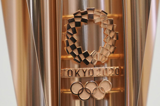 The emblem of the Olympic torch of the Tokyo 2020 Olympic Games is seen during a press conference in Tokyo Wednesday, March 20, 2019. [Photo: AP/Eugene Hoshiko]