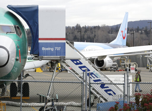 In this Monday, March 11, 2019 file photo, a Boeing 737 MAX 8 airplane being built for TUI Group sits parked in the background at right at Boeing Co.'s Renton Assembly Plant in Renton, Wash. [Photo: AP]