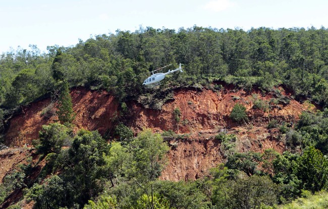 A helicopter flies above the area destroyed by cyclone idai in Chimanimani about 600 kilometres south east of Harare, Zimbabwe, Wednesday, March, 20, 2019. [Photo: AP/Tsvangirayi Mukwazhi]