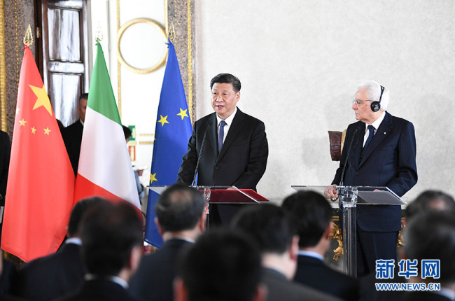 Chinese President Xi Jinping (L) is speaking to representatives during the meetings of the China-Italy Entrepreneur Committee, China-Italy Third Party Market Cooperation Forum and China-Italy Cultural Cooperation Mechanism, held in parallel in Rome, on Friday, Mar. 22. Xi attends the meeting with his Italian counterpart Sergio Mattarella (R). [Photo: Xinhua]