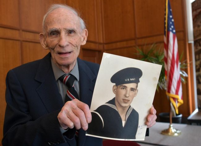 94-year-old WWII veteran finally gets high school diploma. [Photo: St. John's High School social media page]