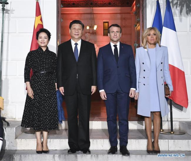 Chinese President Xi Jinping (2nd L) and his wife Peng Liyuan (1st L) pose for a group photo with French President Emmanuel Macron (2nd R) and his wife Brigitte Macron in the southern French city of Nice on March 24, 2019. Xi met with Macron in Nice on Sunday. [Photo: Xinhua/Xie Huanchi]