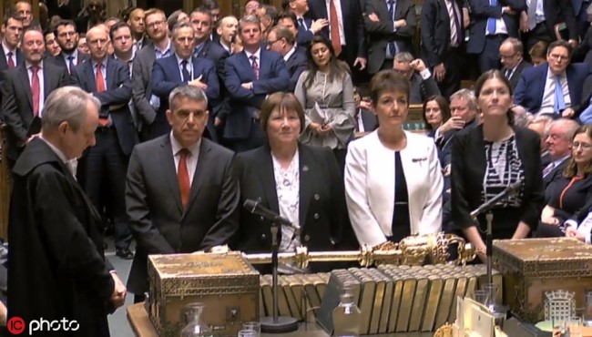 A grab from a handout video made available by the UK Parliamentary Recording Unit shows tellers approaching to announce the voting results on the main motion, which is the Letwin Amendment, has passed by 327 votes to 300, in Westminster, central London, Britain, 25 March 2019.  [Photo: IC]