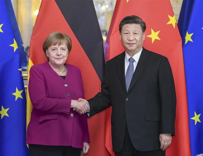 Chinese President Xi Jinping meets with German Chancellor Angela Merkel on the sidelines of a global governance forum co-hosted by China and France in Paris, France, March 26, 2019. (Photo: Xinhua/Xie Huanchi)