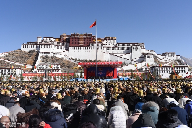 Representatives from various ethnic groups and walks of life gather in the Potala Palace square in Lhasa to celebrate the 60th anniversary of the campaign of democratic reform in Tibet, on Thursday, March 28, 2019. [Photo: VCG]