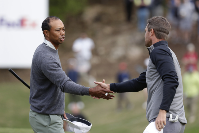 Tiger Woods, left, shakes hands with Lucas Bjerregaard after their quarterfinal match at the Dell Technologies Match Play Championship golf tournament, Saturday, March 30, 2019, in Austin, Texas. [Photo: AP/Eric Gay]