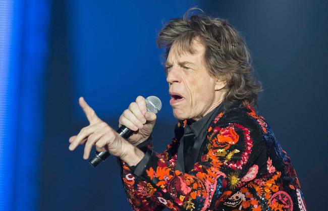 In this Oct. 22, 2017 file photo, Mick Jagger of the Rolling Stones performs during the concert of their 'No Filter' Europe Tour 2017 at U Arena in Nanterre, outside Paris, France. The Rolling Stones are postponing their latest tour so Jagger can receive medical treatment. The band announced Saturday, March 30, 2019 that Jagger “has been advised by doctors that he cannot go on tour at this time.” The band added that Jagger “is expected to make a complete recovery so that he can get back on stage as soon as possible.” [Photo: AP/Michel Euler]