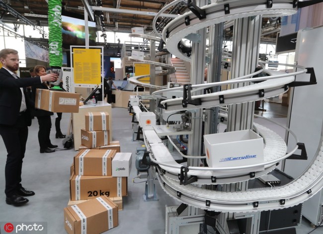 A smart materials handling line at a booth belonging to Sweden, the partner country of the Hanover Fair, on March 31, 2019. From April 1 to April 5, 6,500 exhibitors from 75 countries will have their products on display at what is the world's largest industrial exhibition. [Photo: IC]