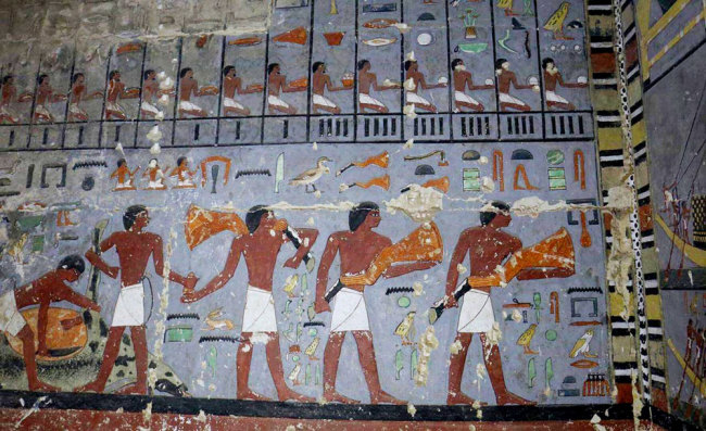 This photo released Tuesday, April 2, 2019, by the Egyptian Ministry of Antiquities, shows pharaonic paintings in the tomb of a noble from the time of one of the earliest pharaonic dynasties, in Saqqara, Giza, Egypt. [Photo: Egyptian Ministry of Antiquities via AP]