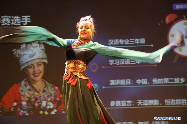 Paula Sorina from the University of Bucharest performs during the "Chinese Bridge" competition in Bucharest, Romania, on April 2, 2019. [Photo: Xinhua]