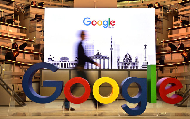 A technician passes by a logo of US internet search giant Google during the opening day of a new Berlin office of Google in Berlin on January 22, 2019. [File photo: AFP/Tobias Schwarz]