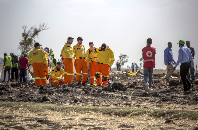 Investigators from Israel examine wreckage at the scene where the Ethiopian Airlines Boeing 737 Max 8 crashed shortly after takeoff killing all 157 on board, near Bishoftu, south of Addis Ababa, in Ethiopia, March 12, 2019. [Photo: AP/Mulugeta Ayene]