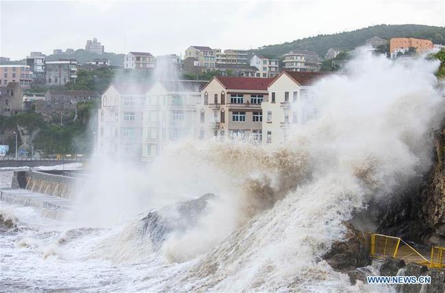 Large waves lap at the coast in Wenling, in east China's Zhejiang Province, seen here on July 10, 2018. [File photo: Xinhua]