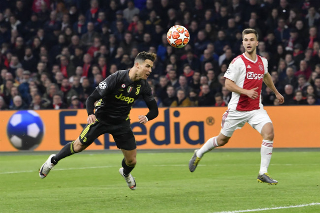 Juventus' Cristiano Ronaldo scores his side's opening goal during the Champions League quarterfinal first leg match between Ajax and Juventus at Johan Cruyff Arena in Amsterdam, Netherlands on Wednesday, April 10, 2019.[Photo: AP]