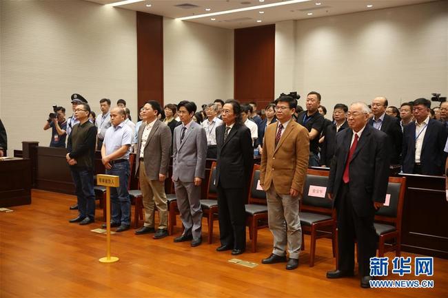 The Supreme People's Court announces sentence on the retried criminal case involving Gu Chujun (R1, front), former chairman of refrigerator maker Guangdong Kelon Electrical Holdings, in Shenzhen, Guangdong Province on Wednesday, April 10, 2019. [Photo: Xinhua]