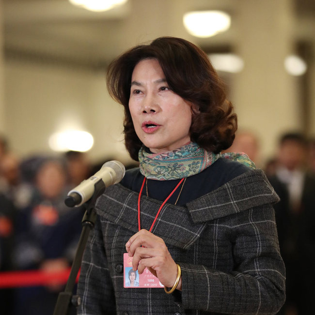 Dong Mingzhu, chairwoman of Gree Electric Appliances and a deputy to the 13th National People's Congress, answers questions in Beijing on March 8, 2019. [Photo: Xinhua]